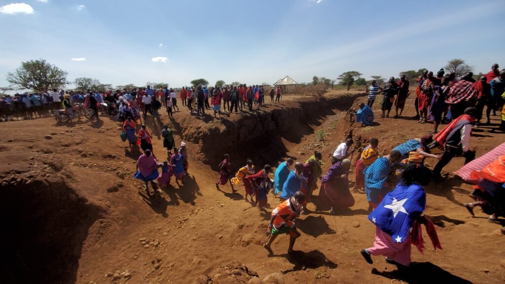 Running to the celebration: When the celebration begins, visitors rush to the event site to greet the guests of honor procession.  Since the 2023 event, hundreds of hours and considerable financial contributions have been made by this community of few means to prepare for this momentous day.