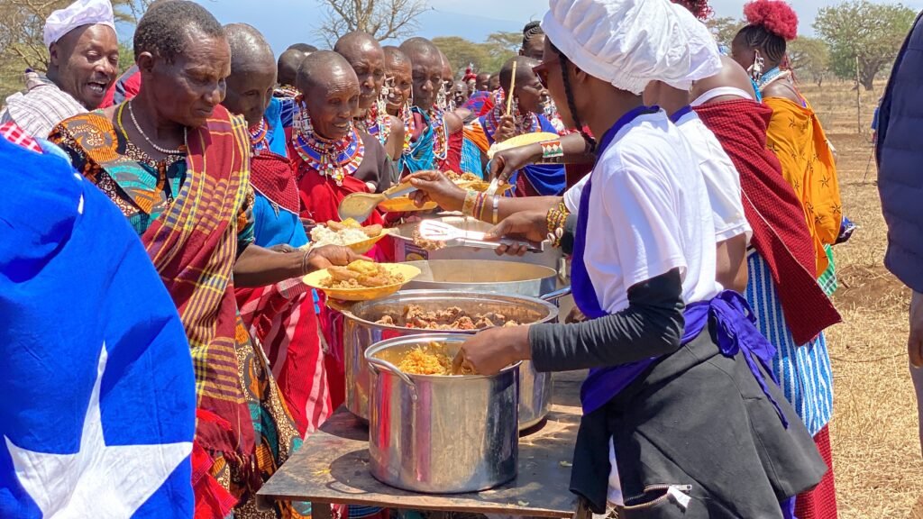 A Day for Feasting: This day was also a day of feasting.  It was a rare day for everyone to feel full.   Traditionally, only cows would have been eaten at such a celebration, but this would have been too costly, so a typical non-Maasai meal of rice, potatoes, and plantains was served.  To honor the importance of cows in such an event, the ADEA Foundation provided four cows for the celebration.  Thanks to all of you who contributed to the buy-a-cow fund.